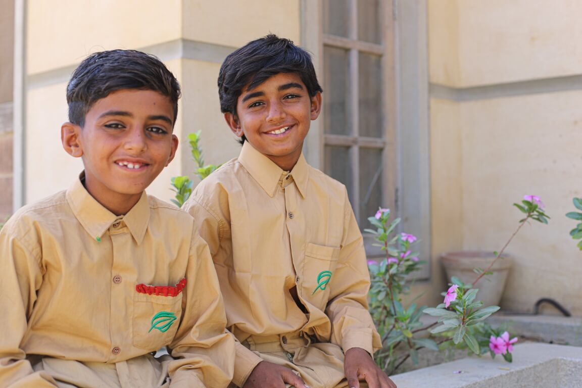 Shahbaz & Mushtaq are all smiles as they return to school!